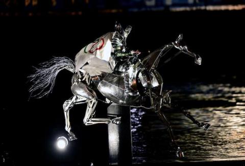 The Horsewoman, wearing the Flag of the International Olympic Committee (IOC)