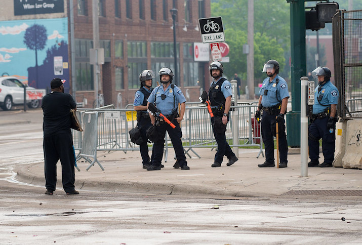 Man exchange words with police outside the 3rd precinct, Minneapolis, Minnesota, May 28, 2020