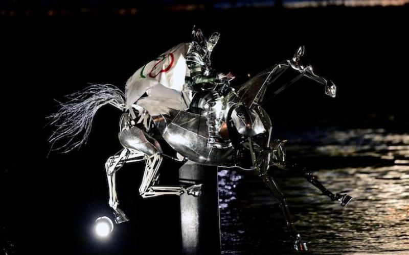 The Horsewoman, wearing the Flag of the International Olympic Committee (IOC)