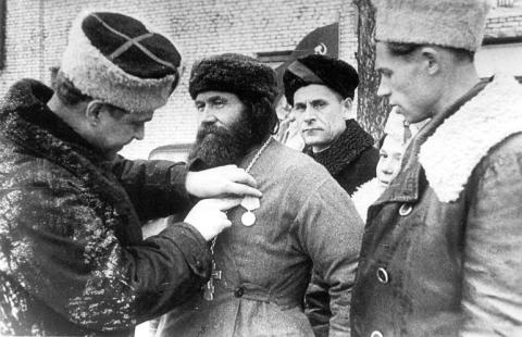 The village priest is awarded the medal 