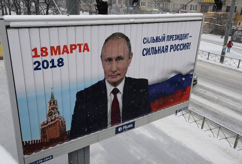 A pre-election banner with the image of the current president of the Russian Federation Vladimir Putin on one of streets of St. Petersburg