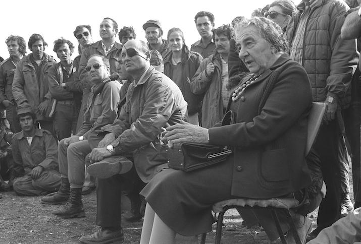 Prime Minister Golda Meir shaking hands with the C.O.S. Haim Bar Lev, standing between Supreme Court Justice Agranat & Defence Minister Moshe Dayan befor departure for USA, at Lod, 24.09.1969